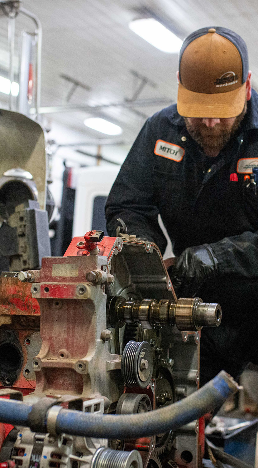 Mechanic working on cam